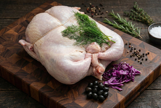 The Turducken Tale: A Journey of a Culinary Marvel from Novelty to Thanksgiving Staple on a wooden cutting board.